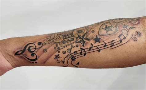 Tattoo Designs Of Music Notes
